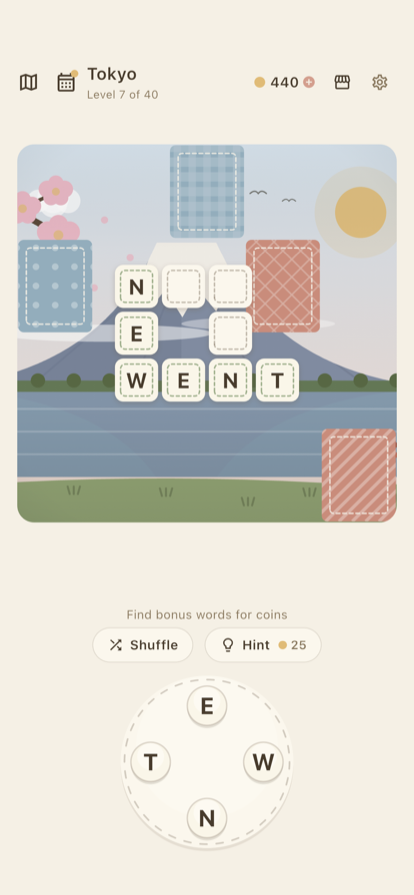 A crossword filling in, with the letter wheel below it